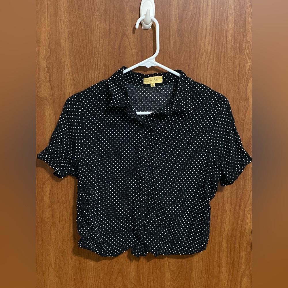 Cute, buttoned-up, polka dot blouse.